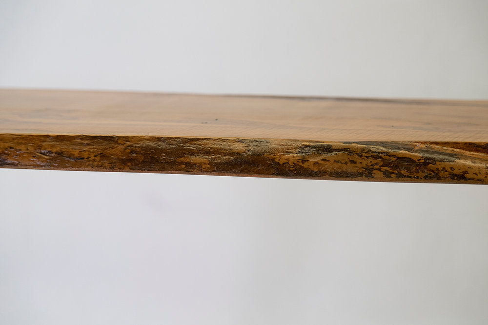 Close-up of a wooden surface with a natural grain pattern on a white background