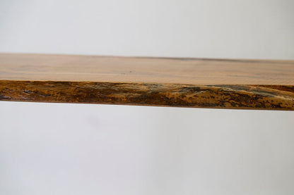 Close-up of a wooden surface with a natural grain pattern on a white background