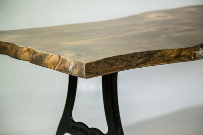 Wooden table with black metal legs on a white background