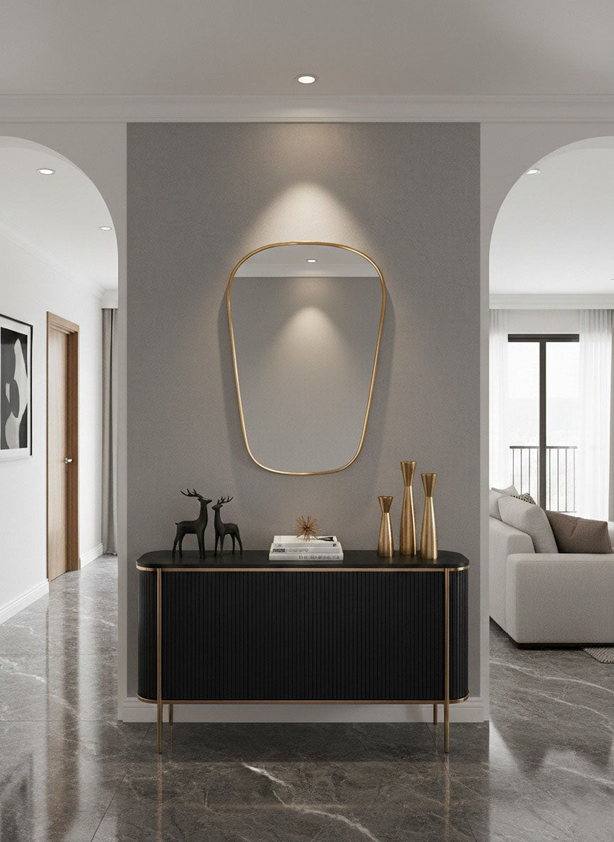 Asymmetrical brass entryway mirror