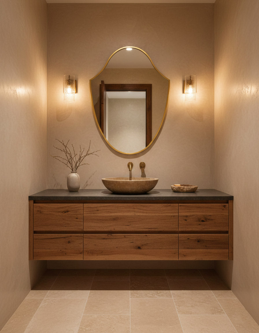 Bathroom vanity with wooden cabinet, round mirror, and sink.