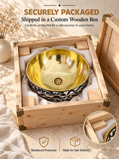 Brass and bone inlay sink secured in white protective padding and wooden corner blocks inside an open shipping crate beneath “Securely Packaged” text.