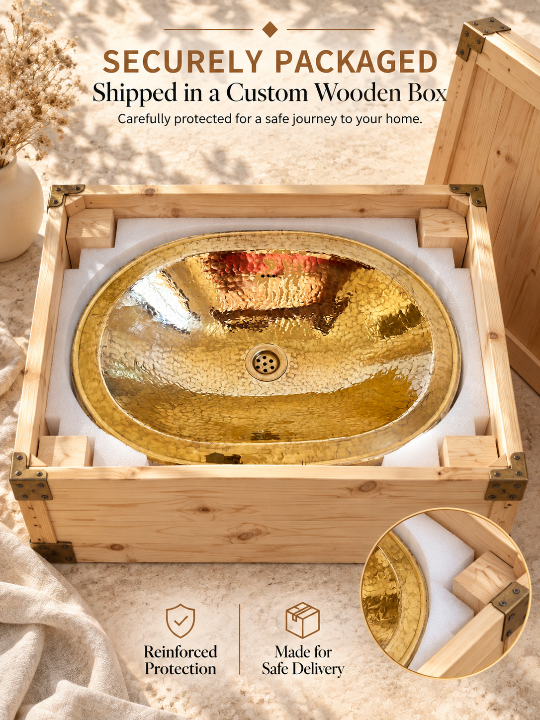 Oval hammered brass sink nestled in fitted white foam inside an open wooden shipping box, with text highlighting secure packaging and safe delivery.
