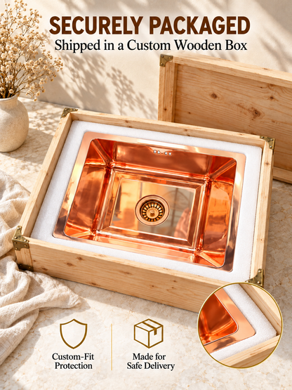 Copper kitchen sink secured in fitted white foam inside an open wooden shipping crate beneath “Securely Packaged” text.