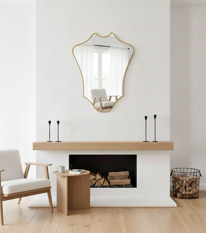 Crowned Curve mirror displayed above fireplace mantel in minimalist living room
