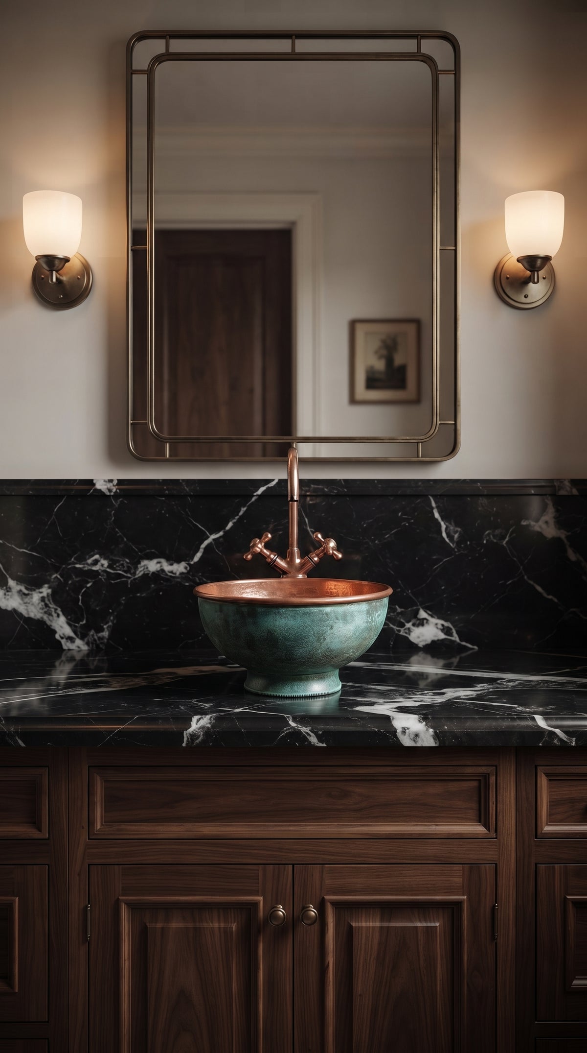 Turquoise-patina copper vessel sink with a tall copper faucet on black veined marble, beneath a rectangular mirror and two wall sconces.