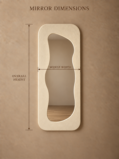 A beige wall mirror with an organic, asymmetrical wavy outline, shown with dimension lines indicating overall height, widest width, and a measurement label at the top reading 'MIRROR DIMENSIONS'.
