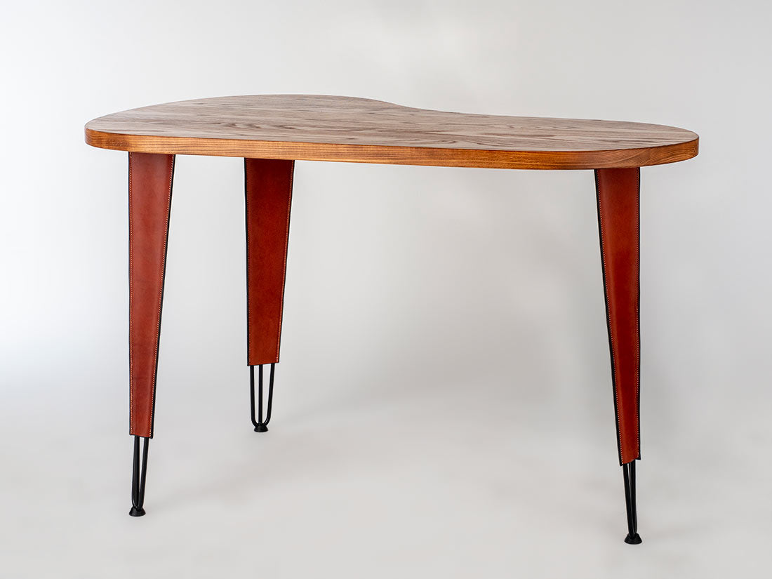 Wooden table with dark legs on a white background