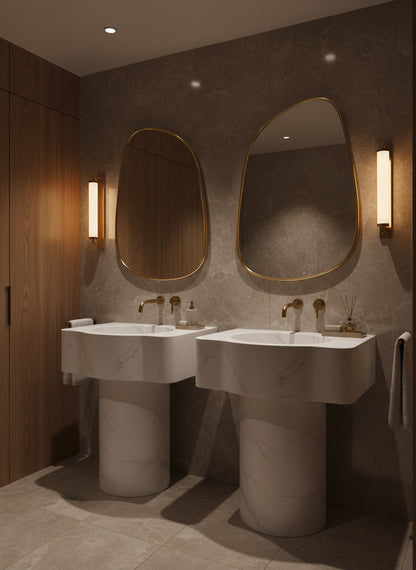 Modern bathroom with two sinks and oval mirrors on a textured wall.