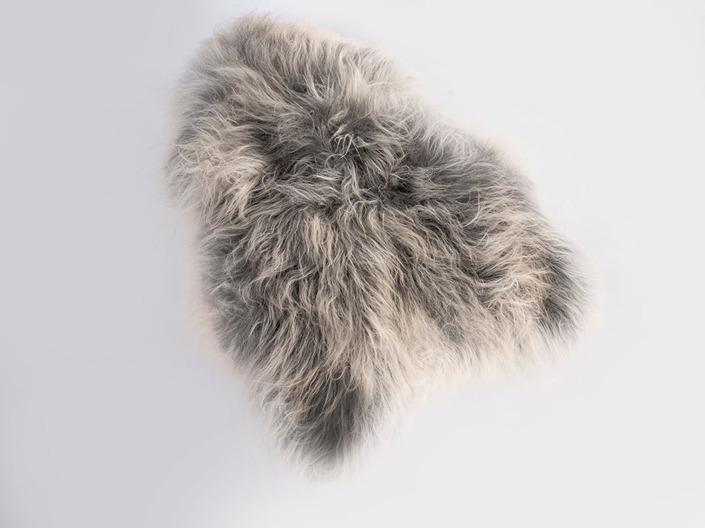 Gray fur rug on a white background