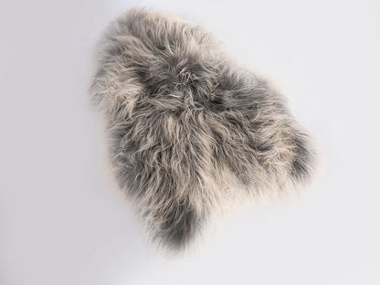 Gray fur rug on a white background