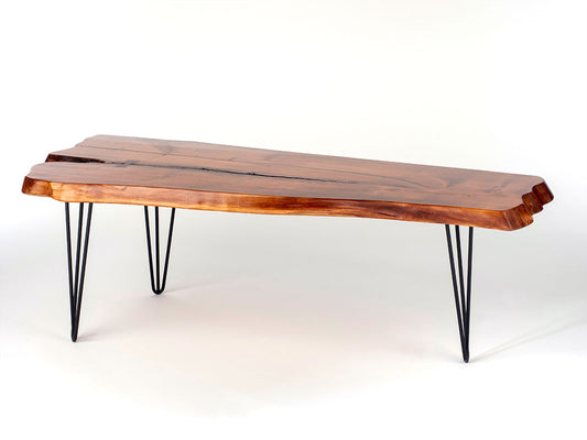 Wooden coffee table with hairpin legs on a white background
