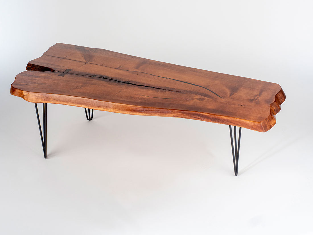 Wooden coffee table with a natural finish on a white background