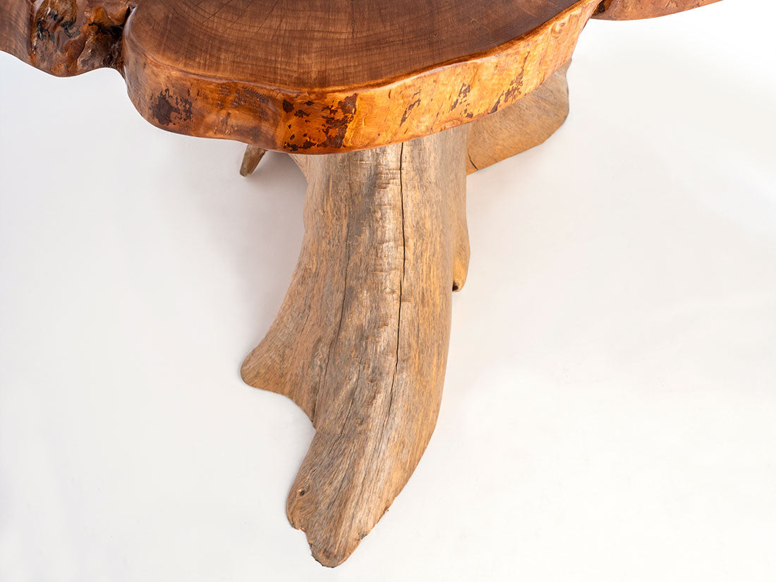 Wooden table with natural edge design on a white background