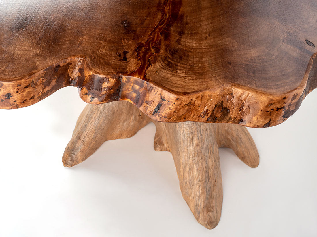 Wooden table with a natural, rustic design on a white background