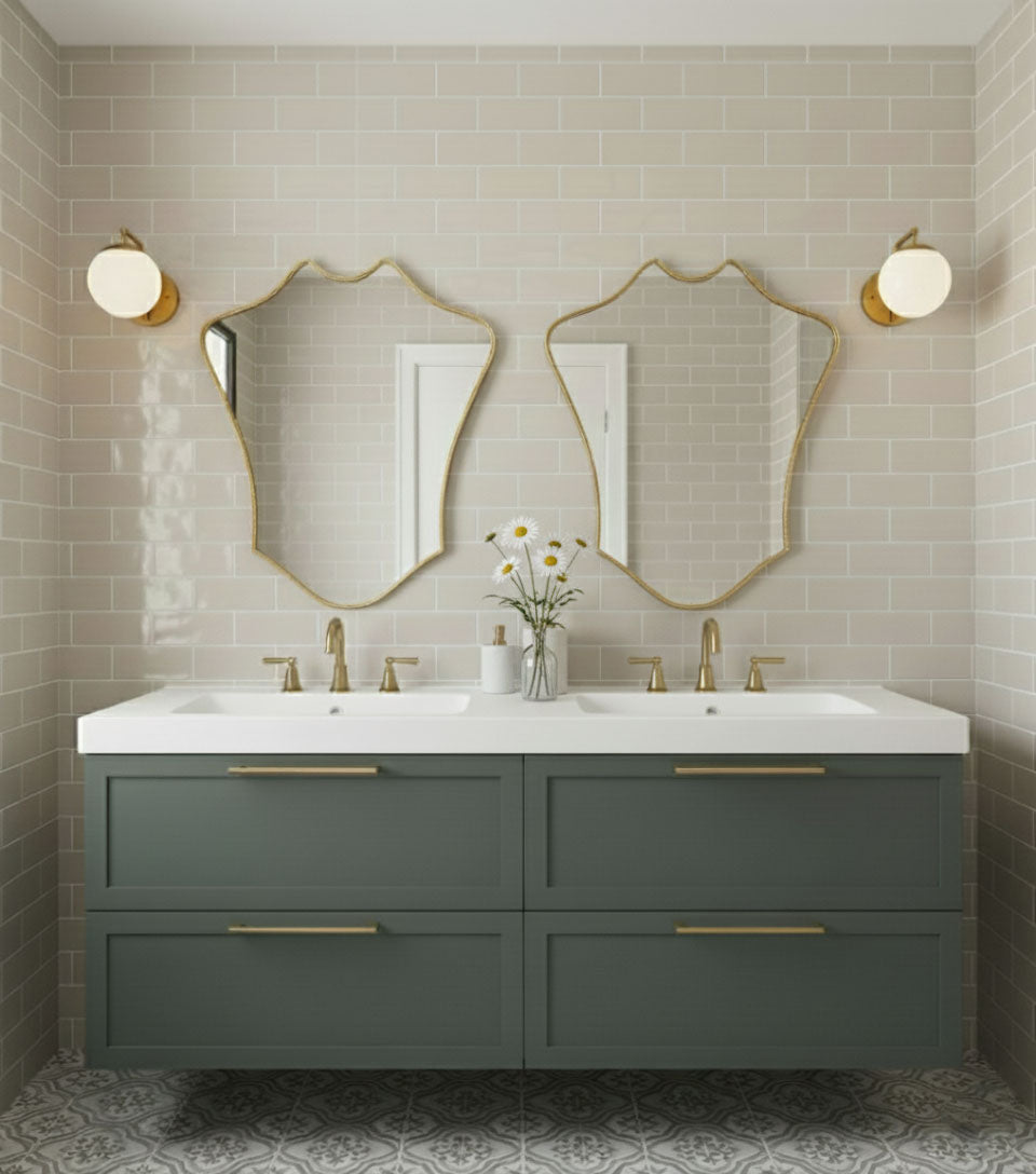 Pair of Crowned Curve brass mirrors above double vanity sink