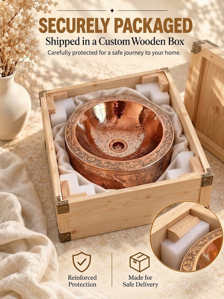 Round engraved copper sink secured in protective white foam inside an open wooden shipping crate beneath “Securely Packaged” text.