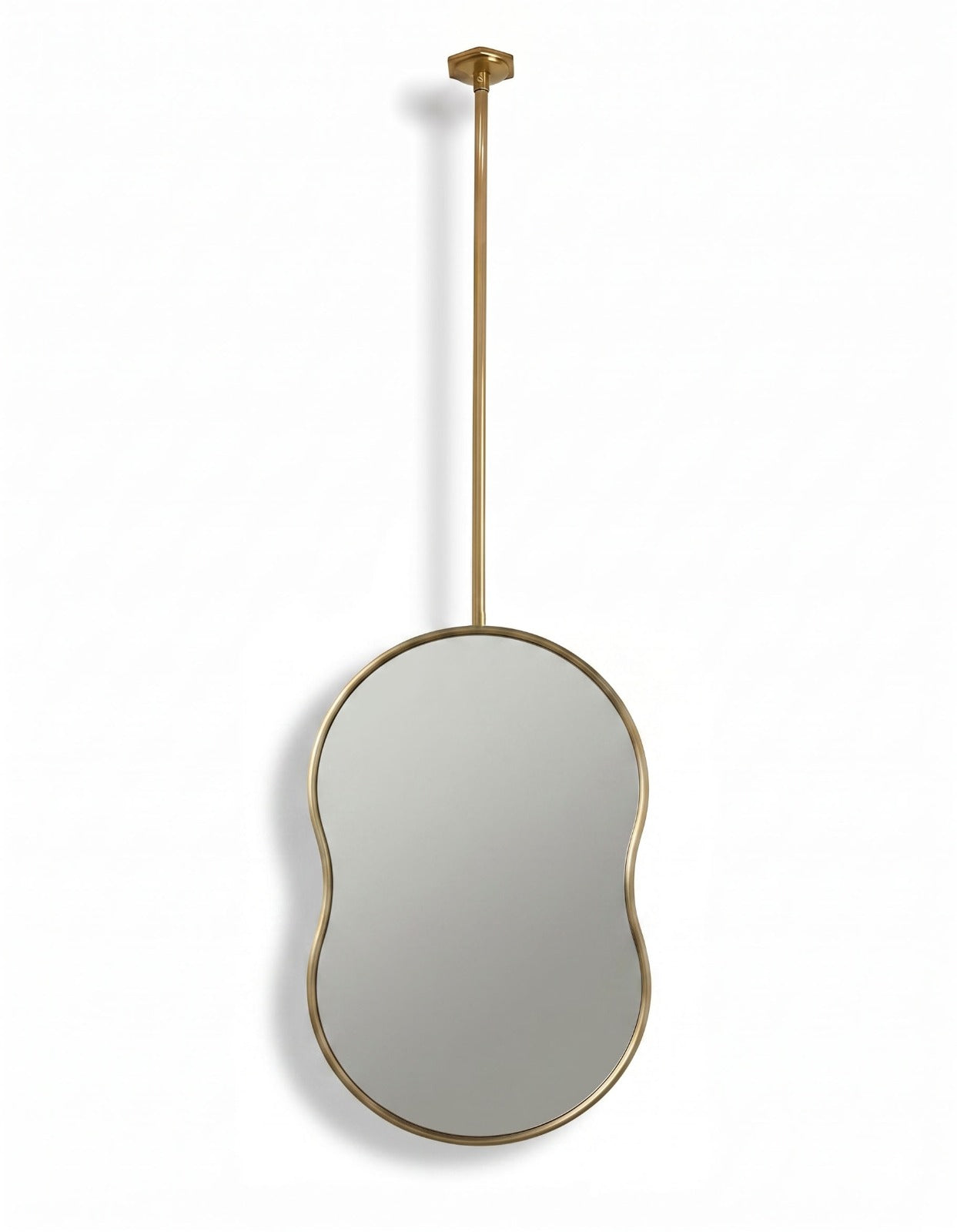 Handmade organic oval brass mirror with slim brass frame and ceiling-mounted suspension rod.