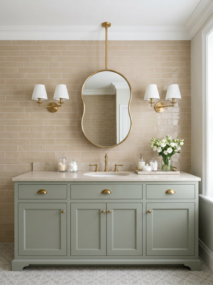 Ceiling-mounted pebble brass mirror with handcrafted gold frame in a contemporary bathroom.