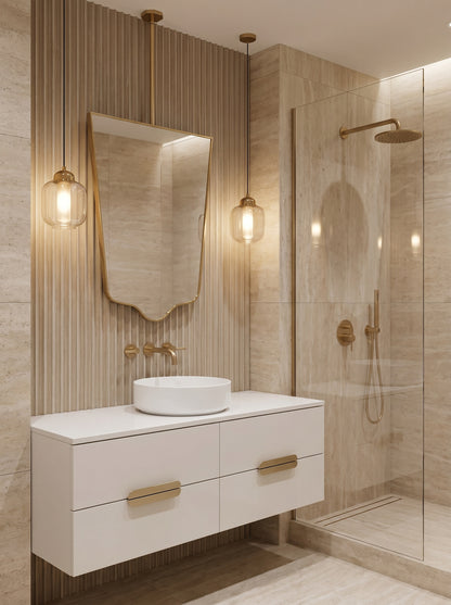 Luxury hanging brass mirror with geometric shield silhouette in a modern bathroom.