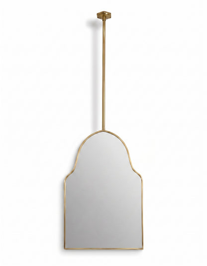 Suspended architectural arch mirror with slim brass frame on a clean white background.