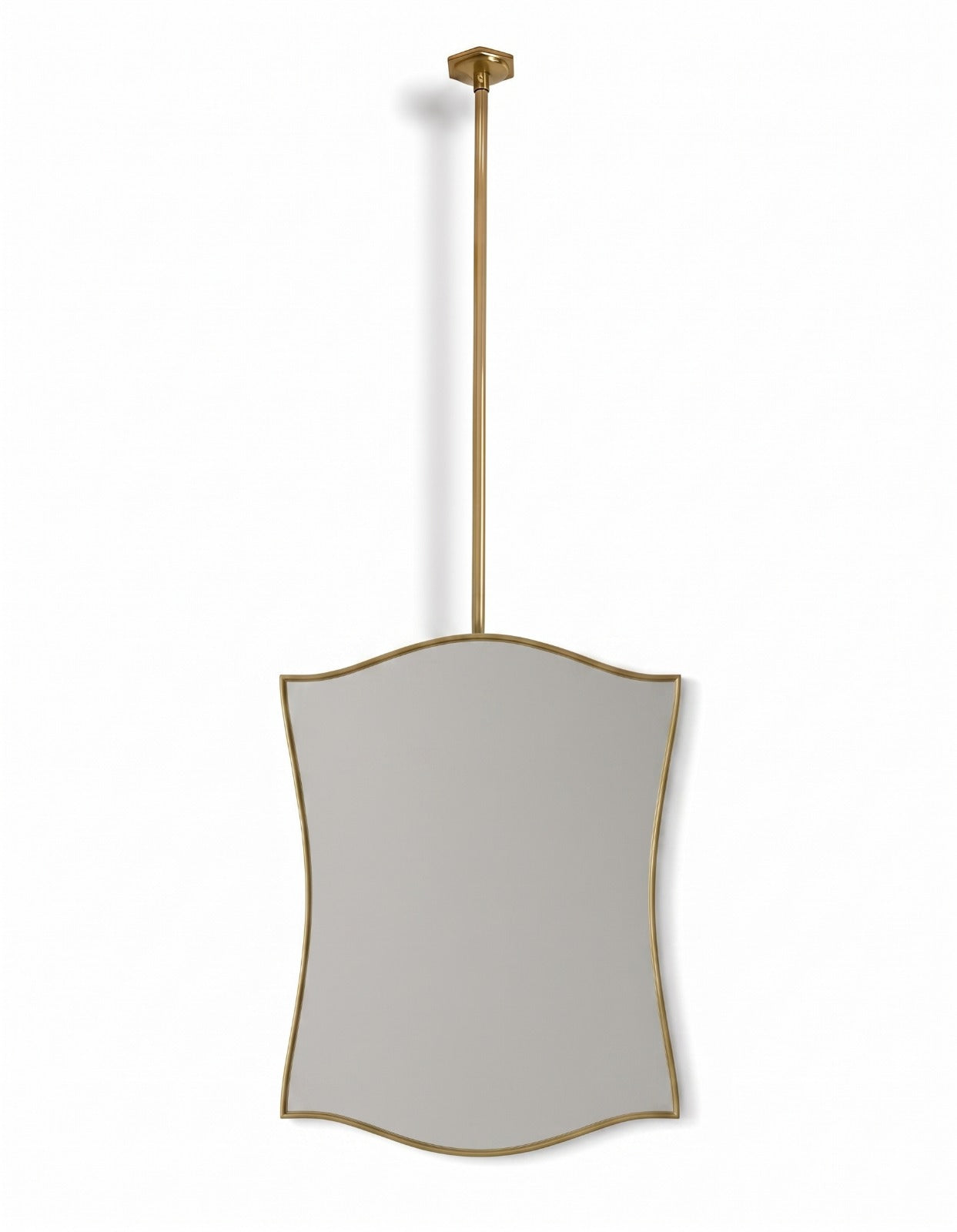 Ceiling-mounted wavy brass mirror with slim gold frame on white background