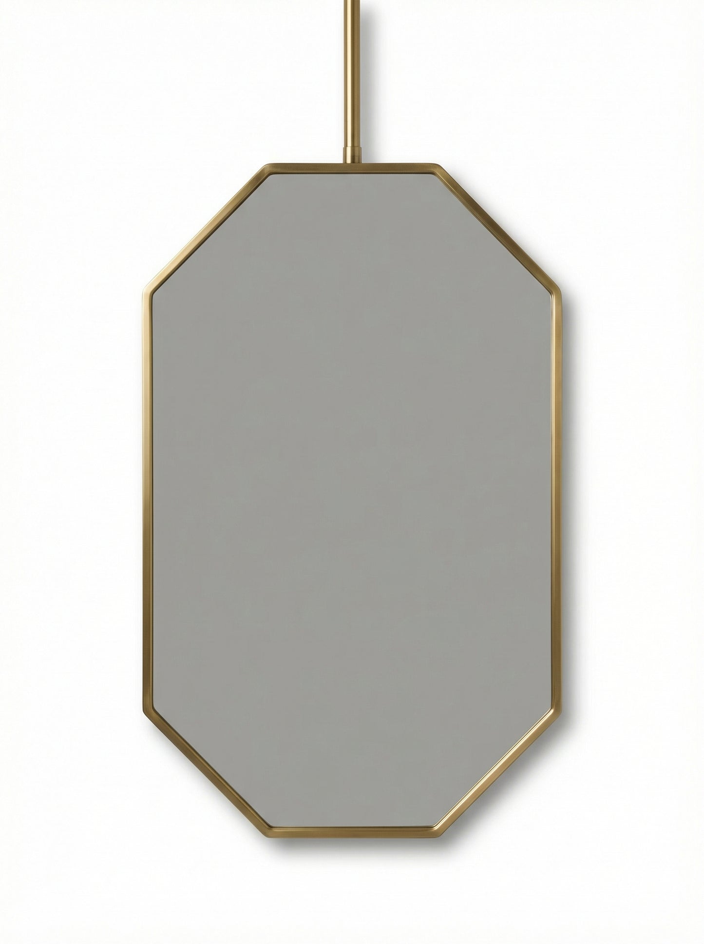 Suspended octagonal brass mirror isolated on white background