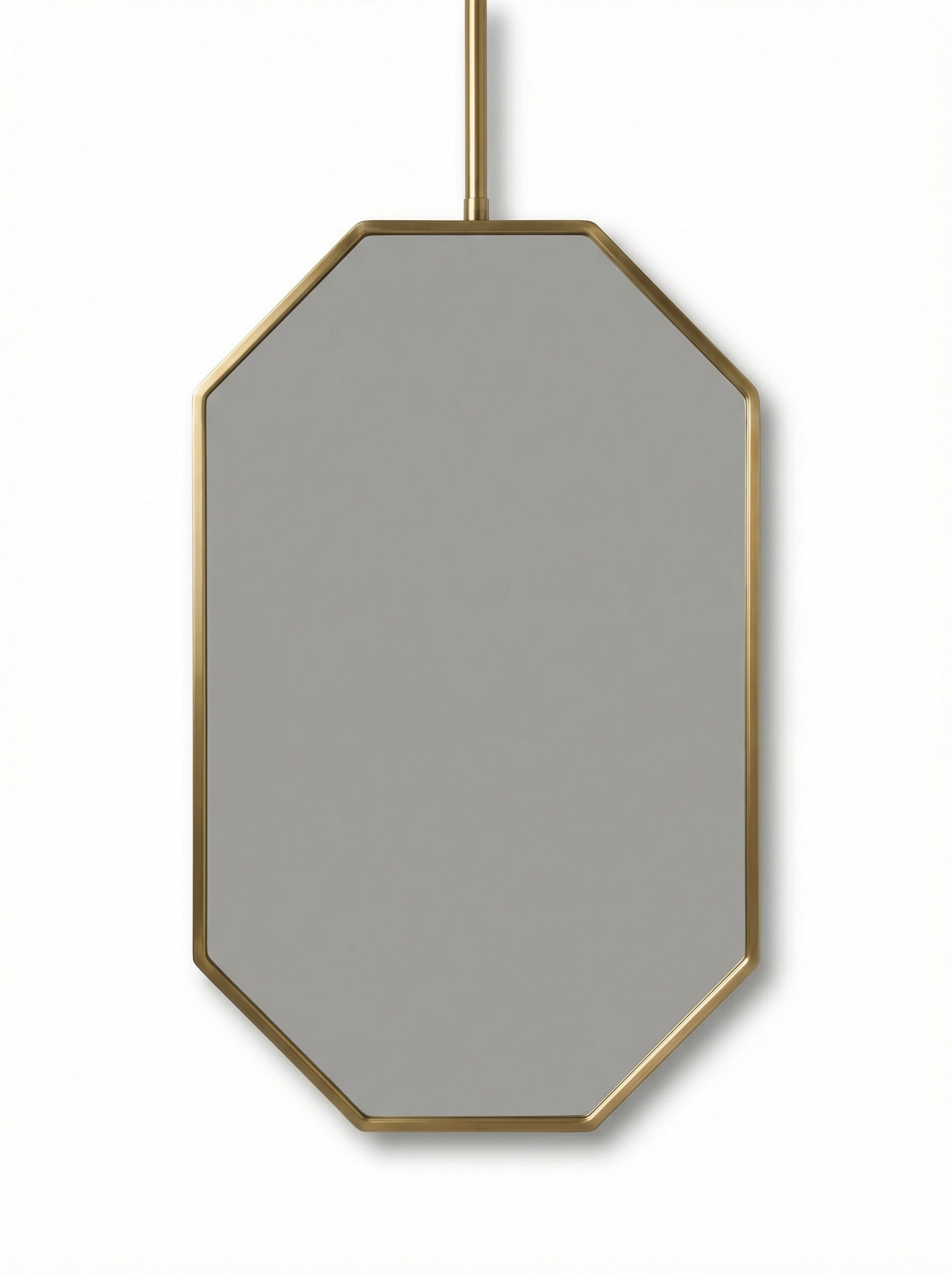Suspended octagonal brass mirror isolated on white background