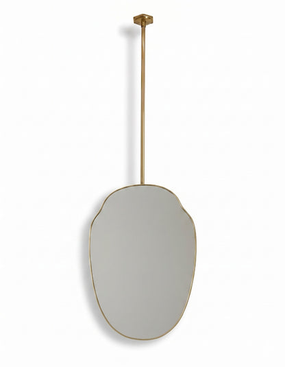 Ceiling mounted organic brass mirror with a slim handcrafted gold frame.