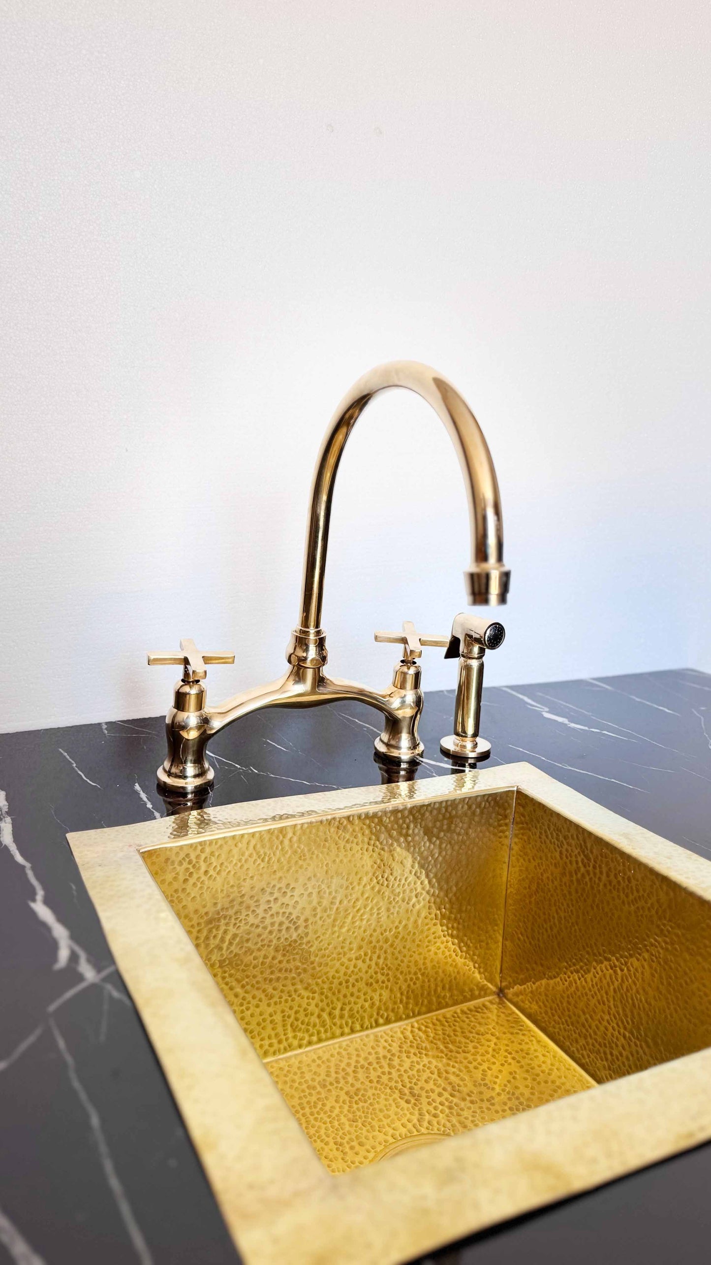 Antique Brass Kitchen Faucet in kitchen with sink 