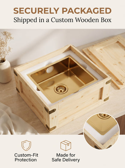 Brass kitchen sink secured in fitted white foam inside an open wooden shipping crate beneath “Securely Packaged” text.
