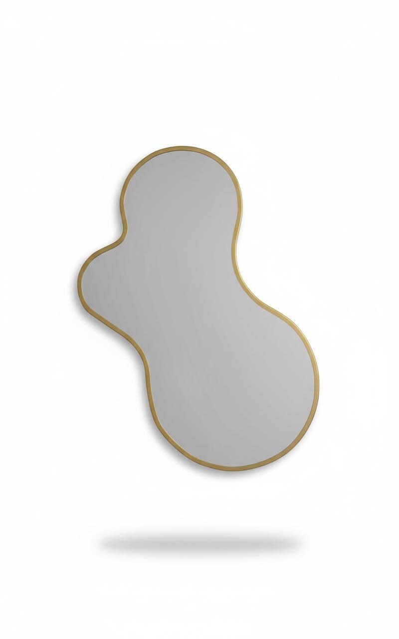 Handmade amoeba-shaped brass mirror isolated on white background