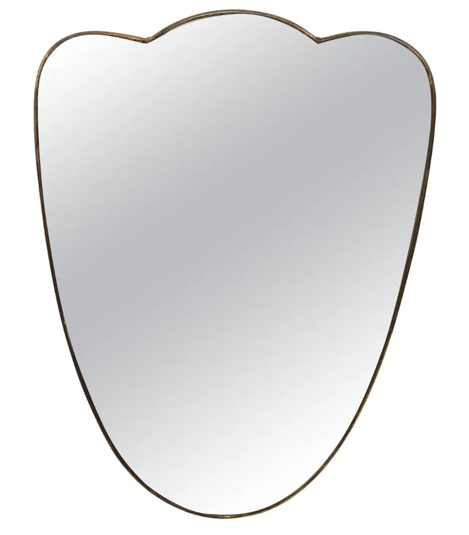 Soft Crest brass mirror isolated on white background