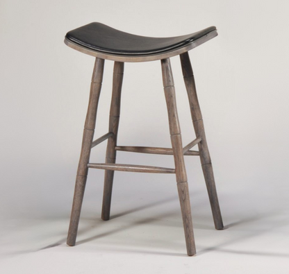 Wooden bar stool with a black cushioned seat on a white background