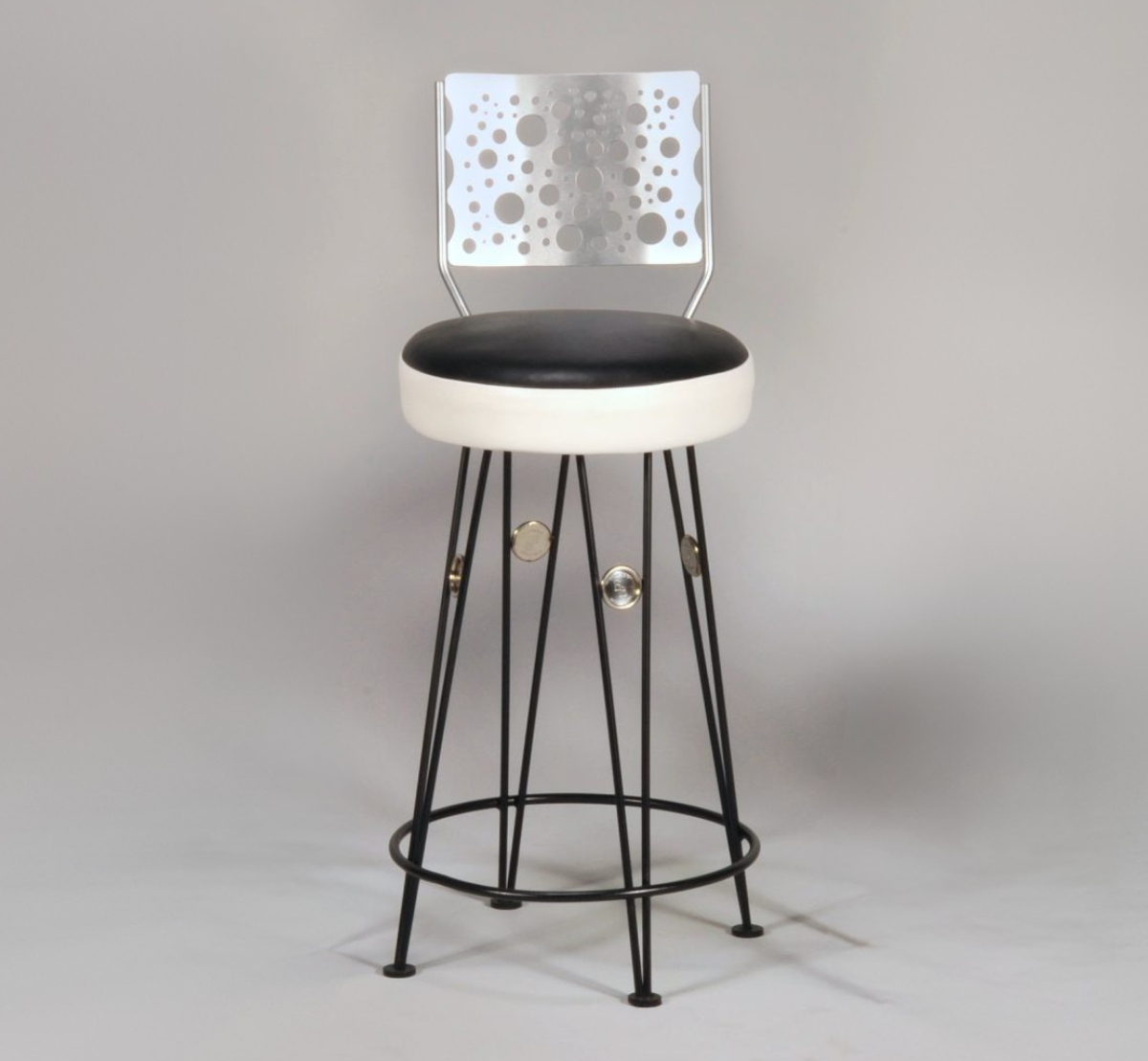 Bar stool with black seat and perforated backrest on a gray background