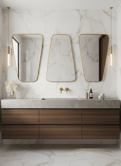 Triple brass mirrors above marble vanity