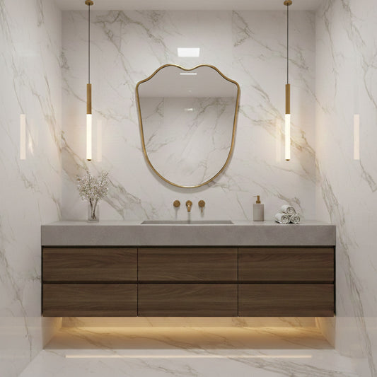 shield  brass vanity mirror in white marble bathroom