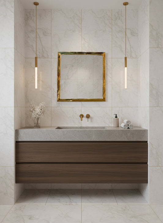 Minimal marble bathroom with square brass mirror and pendant lights