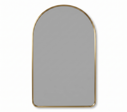 Simple arched brass mirror with slim gold frame on white background
