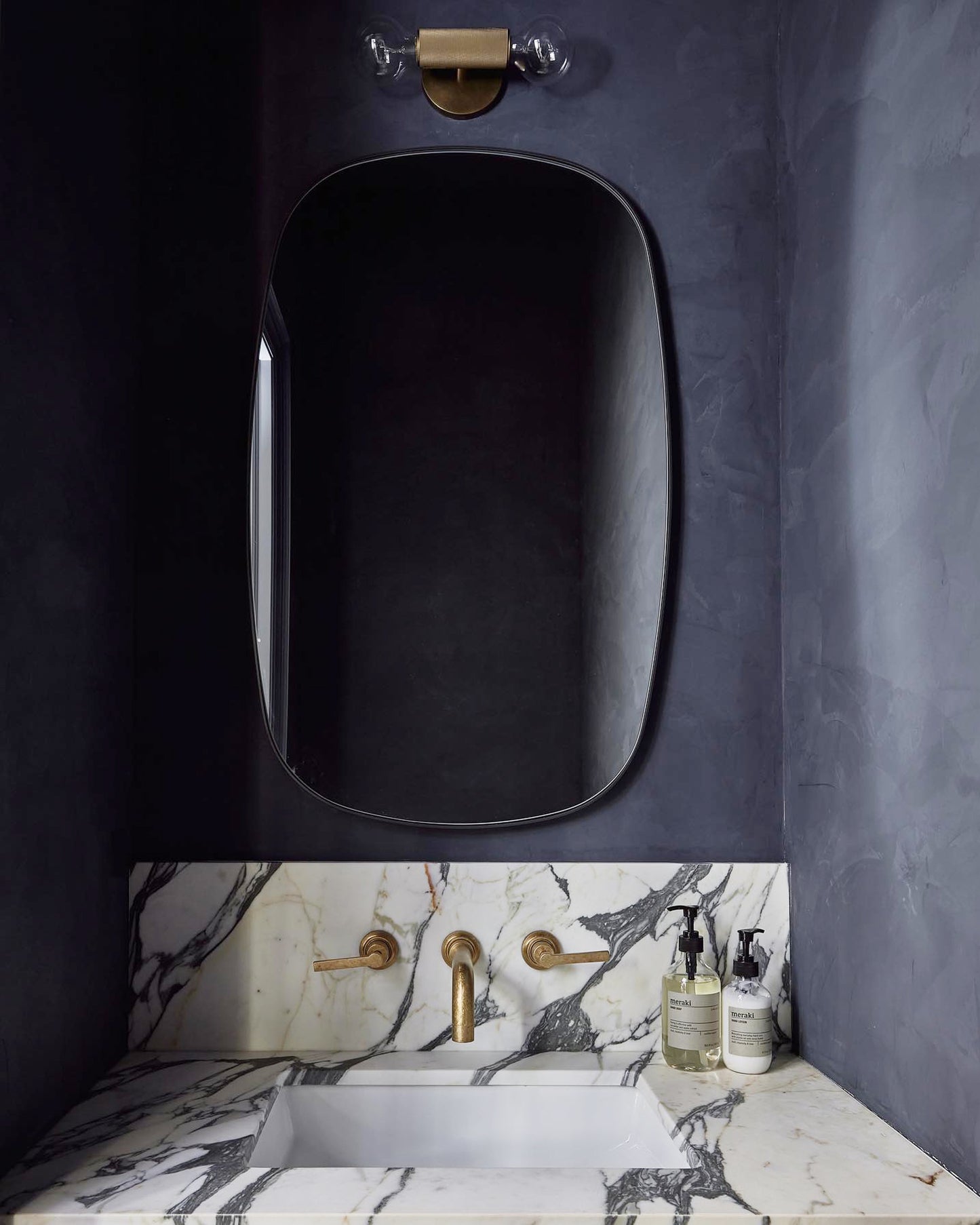 black rectangular mirror on powder room