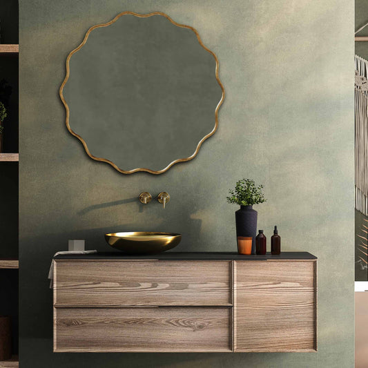 a bathroom vanity with a round Wavy Mirrors above it