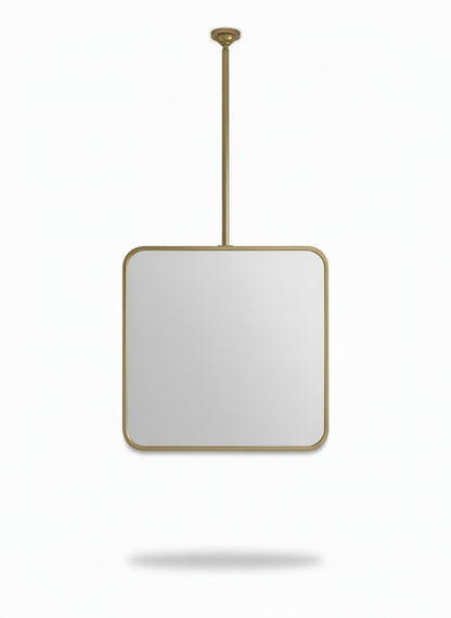 Handmade suspended square brass mirror isolated on white background.