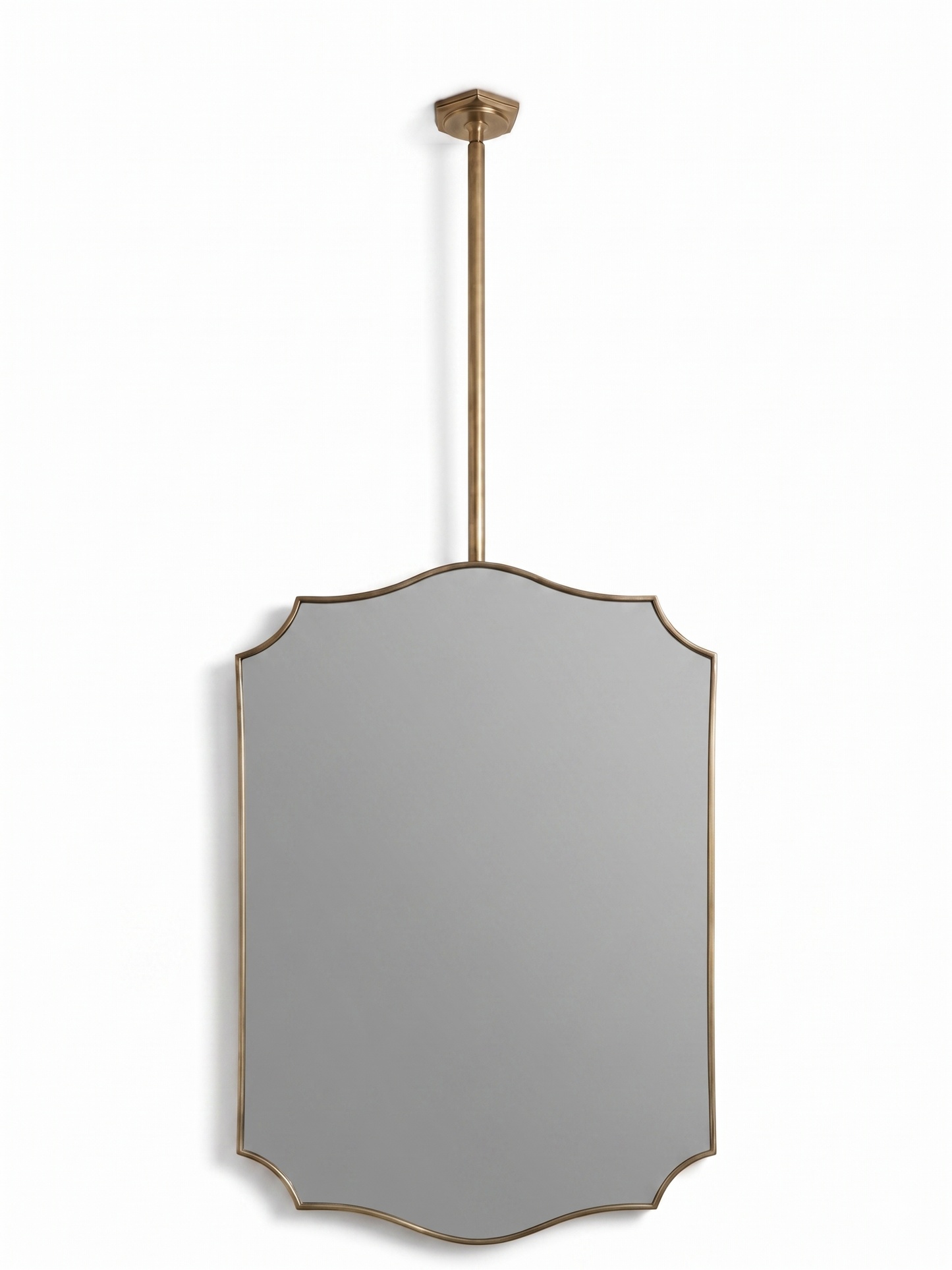 Handmade gold brass suspended crest mirror on white background