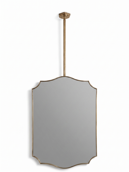 Handmade gold brass suspended crest mirror on white background
