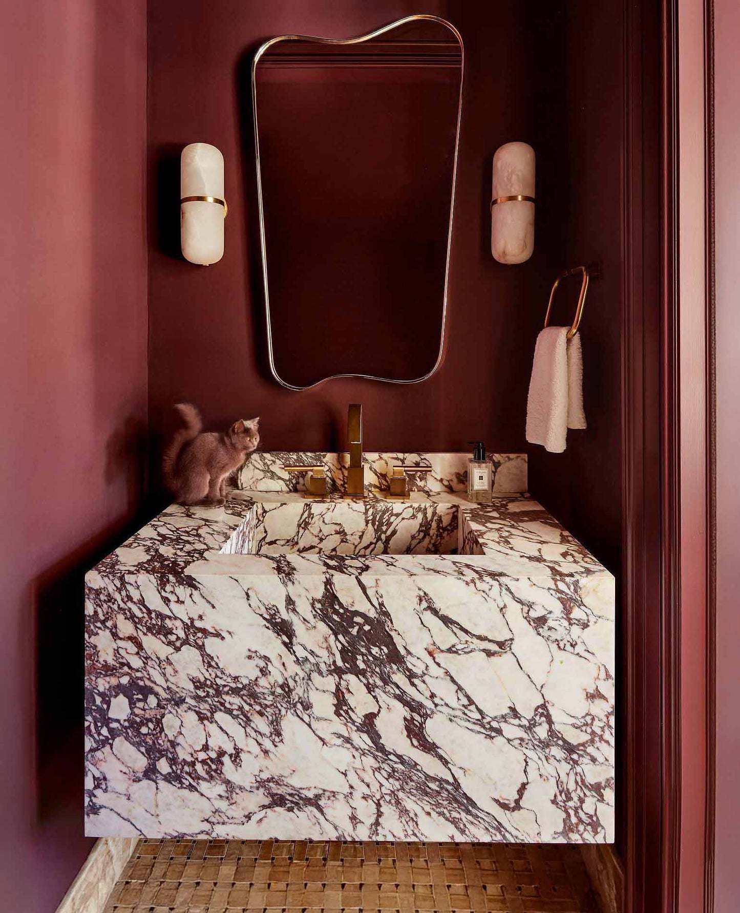 brass mirror in powder room 