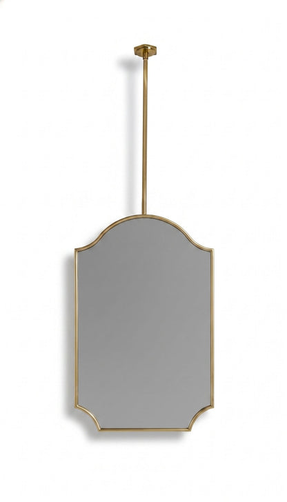  Curved top brass hanging mirror with ceiling-mounted rod.