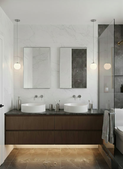 Rectangular wall mirrors above double bathroom vanity.