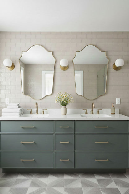 Pair of shield-shaped brass mirrors over double bathroom vanity