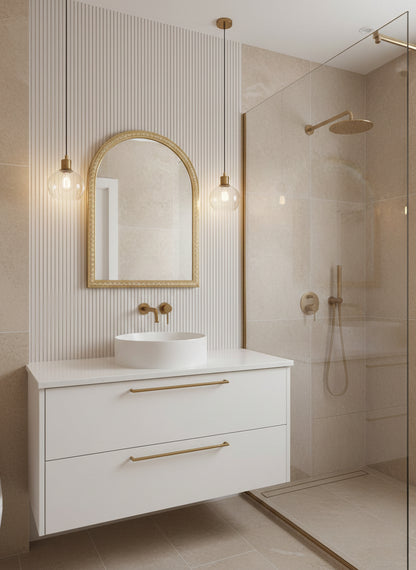Brass arch mirror in modern bathroom