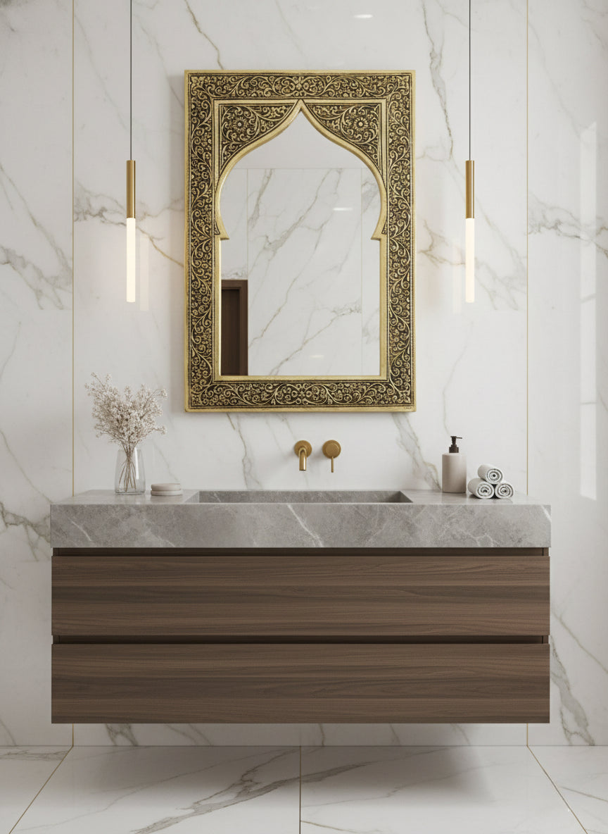 Engraved brass arch mirror above bathroom vanity